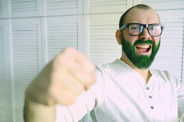 Shocked and happy. happy saint patricks day. bearded man with
wide open eyes celebrating saint patricks day. hipster in
leprechaun hat and costume. irish man with beard wearing
green.