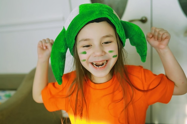 Shocked and happy. happy saint patricks day. bearded man with\
wide open eyes celebrating saint patricks day. hipster in\
leprechaun hat and costume. irish man with beard wearing\
green.