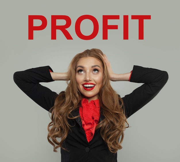 Shocked model looking at profit text on white background