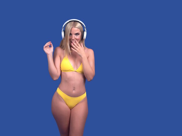 Shocked woman in bikini and headphones looking at camera with astonishment