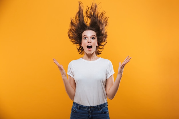 Shocked young woman looking camera