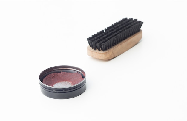 shoe polish and brush shoe on white background