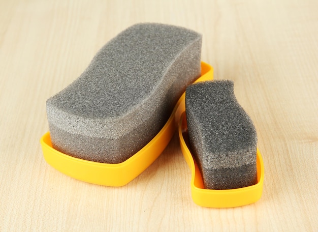 Shoe shine sponges on wooden background