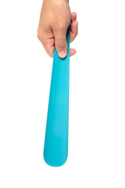 Shoe spoon in hand on a white background