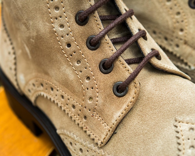 Shoelaces tied on sneakers with metal eyelets