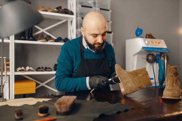 Shoemaker fix the shoe, footwear repair service