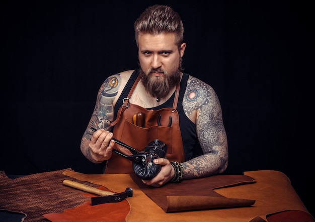 Shoemaker makes artisan shoes with old tools for leather working