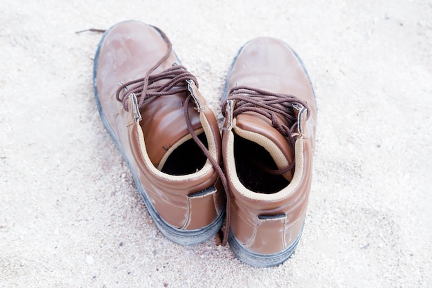 shoes on beach sand as background