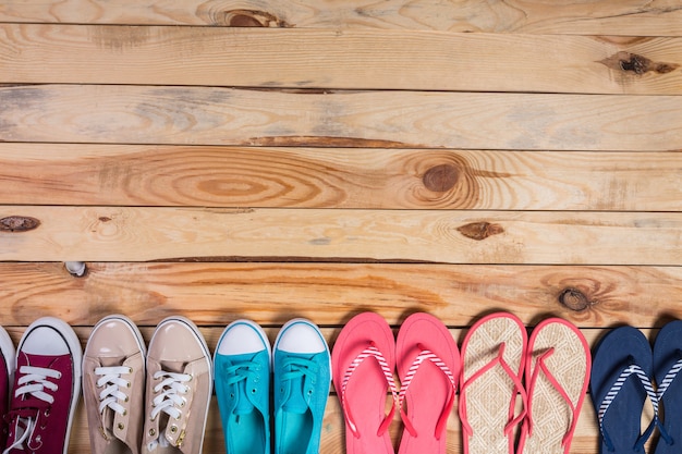 Shoes on brown wooden floor standing in line