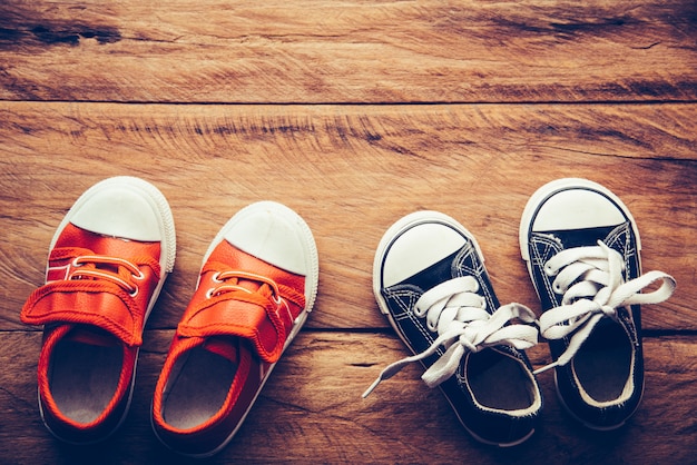 Shoes for children on wooden floor