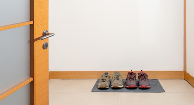 shoes on doormat, front view