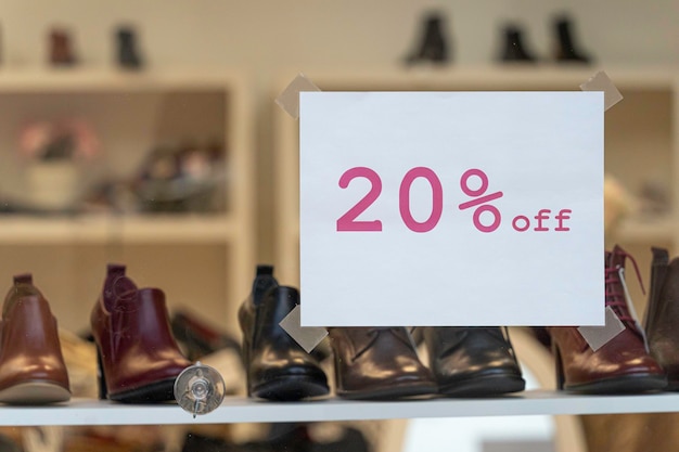 Shoes for sale on display in shop window