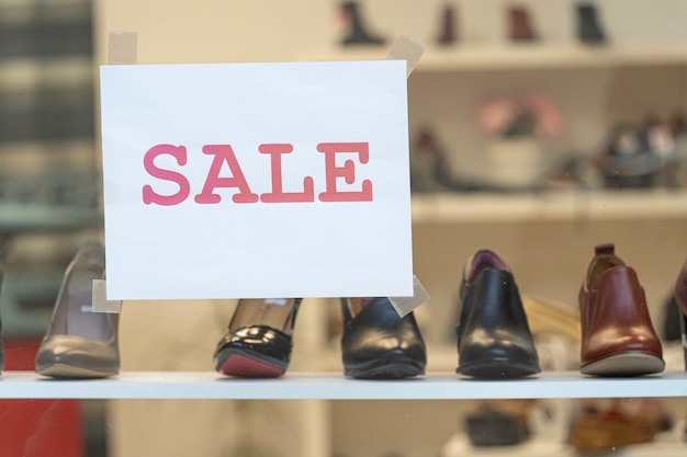 Shoes for sale on display in shop window