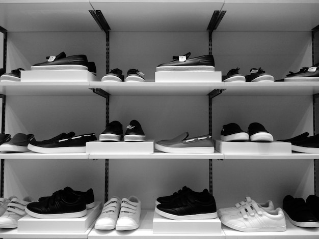 Shoes on shelves for sale in store