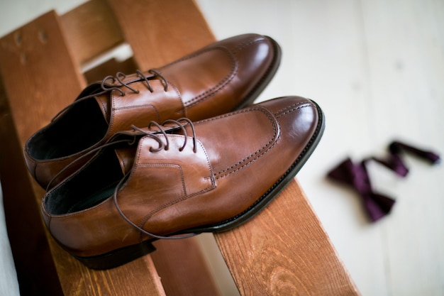 Shoes stacked in composition on a black desk