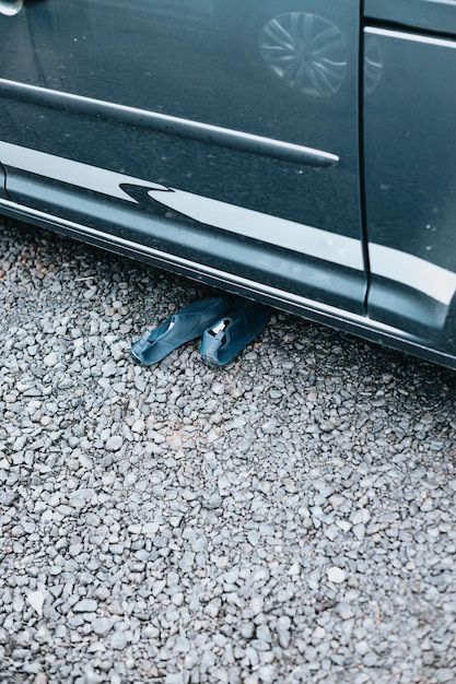 Shoes next to a van door stuff ready to start the route\
traveling across iceland sleeping outdoors camping and\
exploring