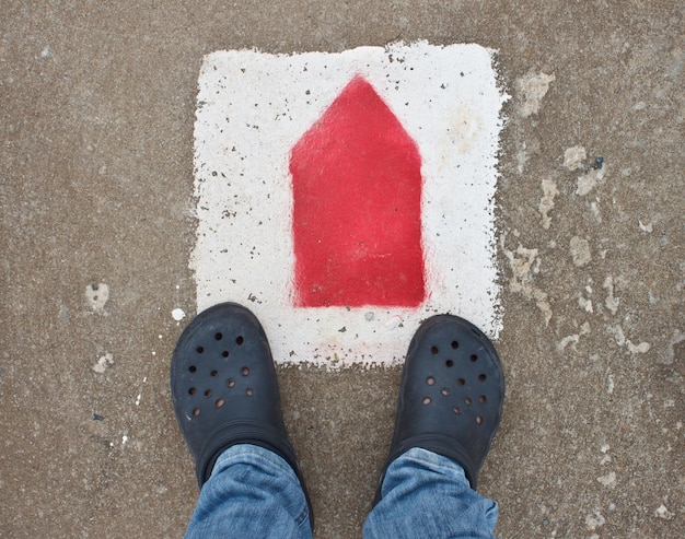 shoes with arrows on the road