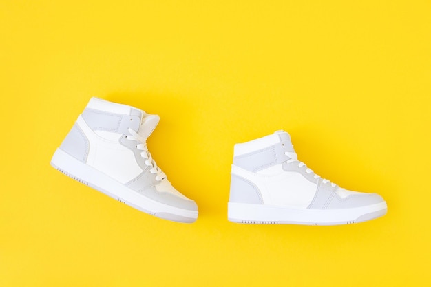 Shoes on yellow background Step by step in flat style Success and development creative concept Top view