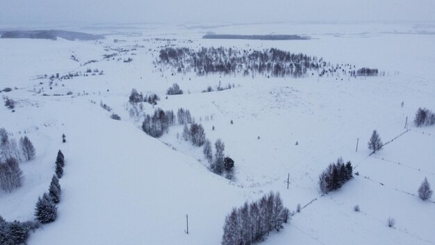 Shooting from a drone in winter forests and fields