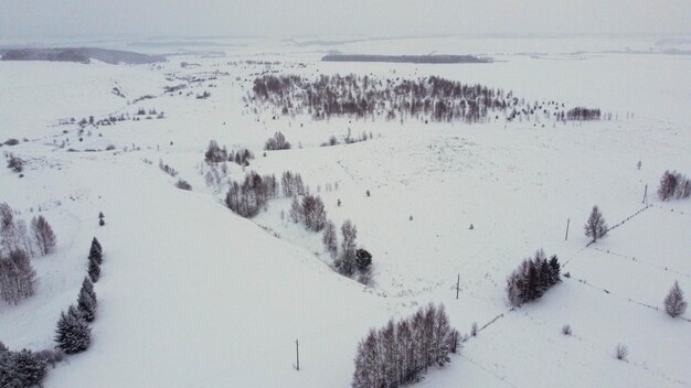 Photo shooting from a drone in winter forests and fields