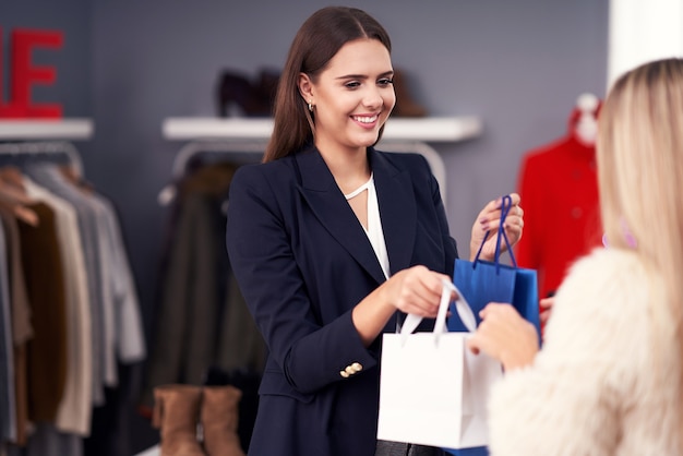 shop assistant serving the customer in store