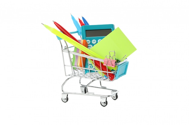 Shop trolley with stationery isolated on white