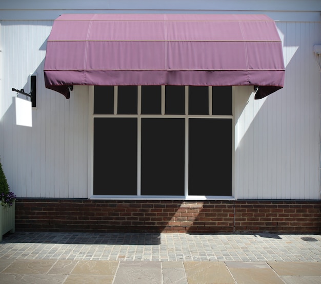 Photo shopfront vintage store front with canvas awnings and blank display