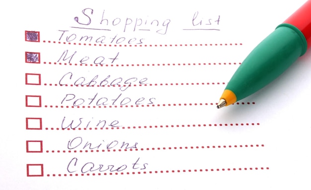 Shoping list and pen closeup