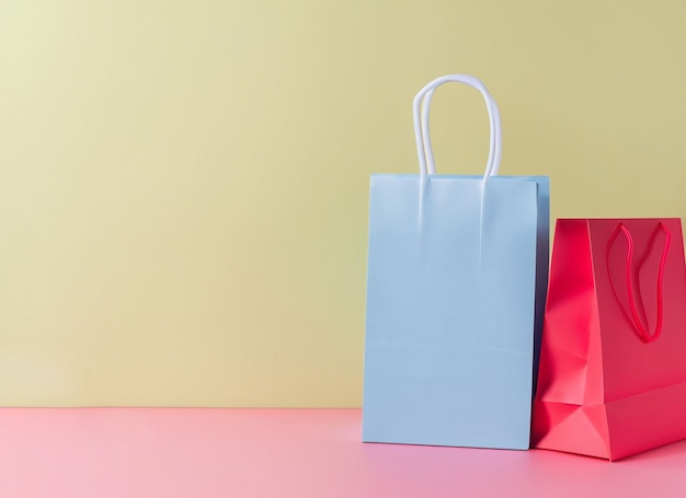 Shopping bag near placard pastel background with copy space