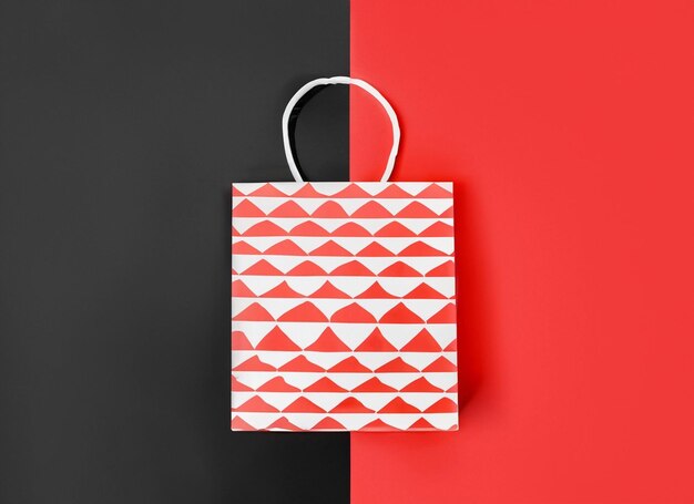 shopping bag on red and black background blue