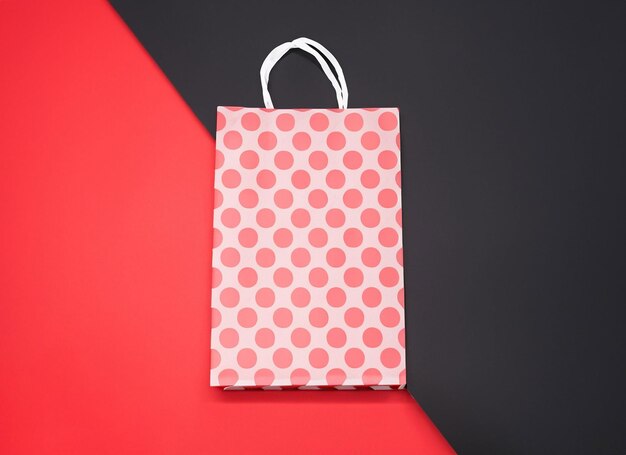 shopping bag on red and black background blue