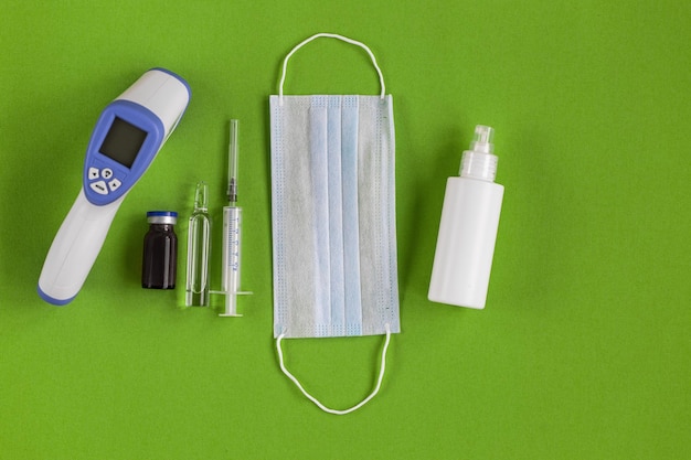 Shopping basket cart full of pills and medical supplies over light grey background