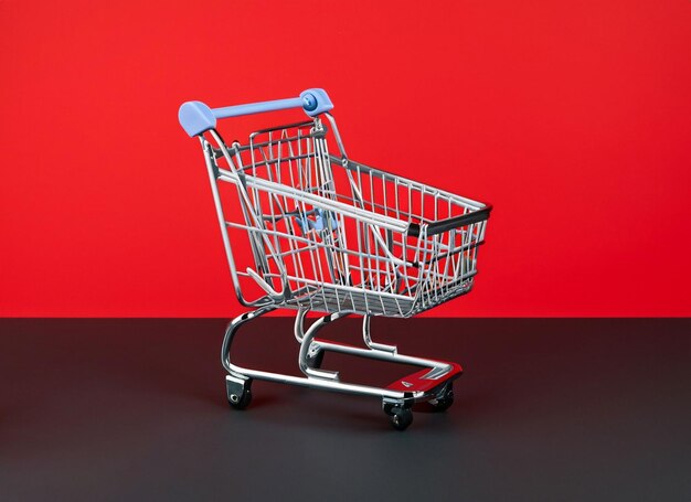 Shopping cart on black and red background blue