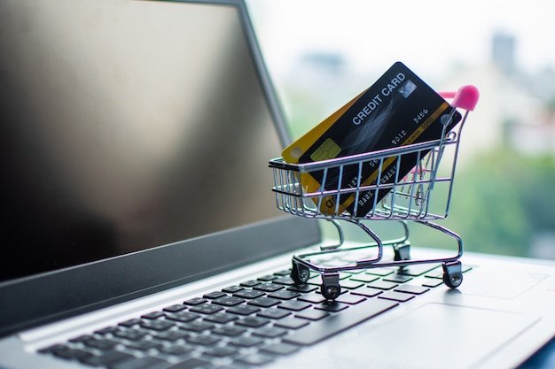 Shopping cart and credit card on computer, shopping online concept.