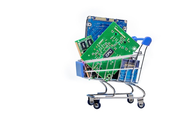 Shopping cart filled with computer parts electronic chips cpu isolated on white background