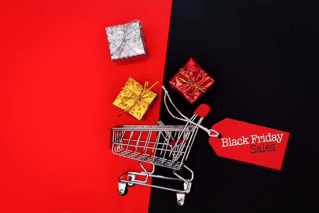 shopping cart and gift box with price tag, Black Friday sale concept