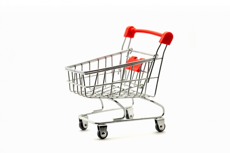 Photo shopping cart is empty on white wall