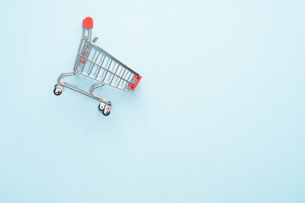 Shopping cart isolated on blue background