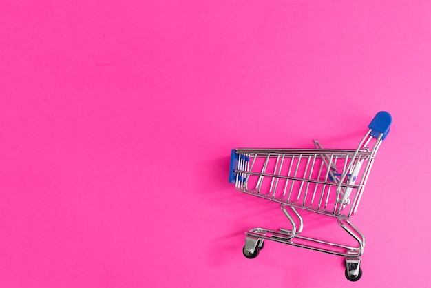 A Shopping Cart Isolated On pink background