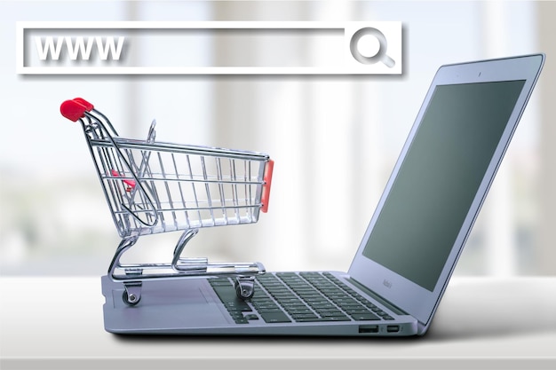 Shopping cart on laptop, close-up view