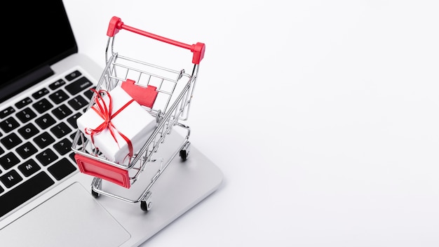 Shopping cart above laptop