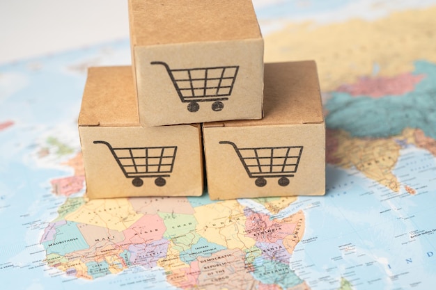 Shopping cart logo on box with on africa map background;\
banking account, investment analytic research data economy,\
trading, business import export online company concept.