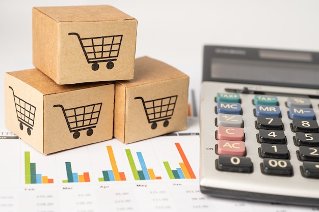 Shopping cart logo on box with calculator on graph background.\
banking account, investment analytic research data economy,\
trading, business import export transportation online company\
concept.