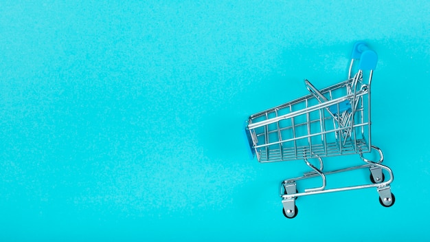 Photo shopping cart on plain background