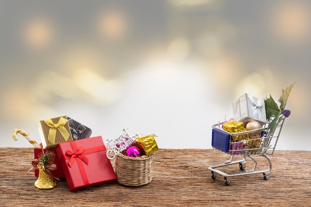 Shopping cart present box color ribbon on white background for christmas birthday special 