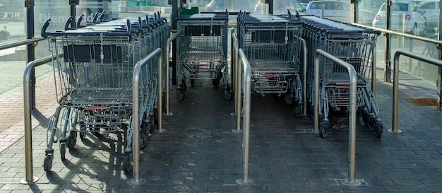 Photo shopping cart return area in a supermarket car park