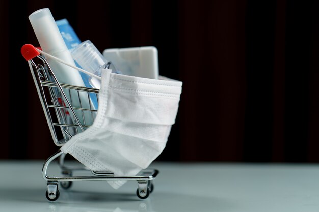 Shopping cart and sanitizer with protective face mask