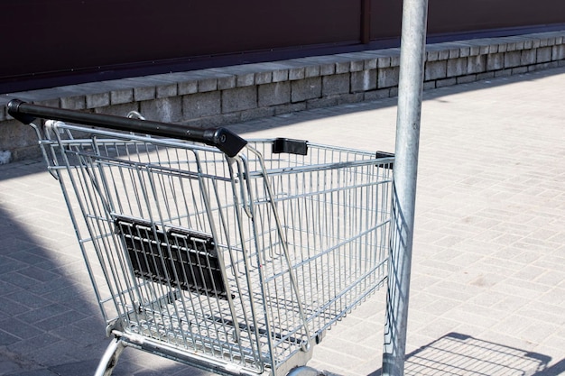 Shopping cart on the sidewalk close up