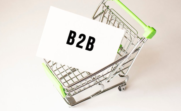 Shopping cart and text B2B on white paper