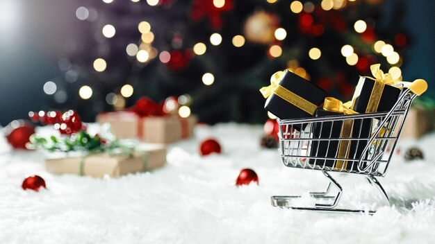 Shopping cart with Christmas gifts box